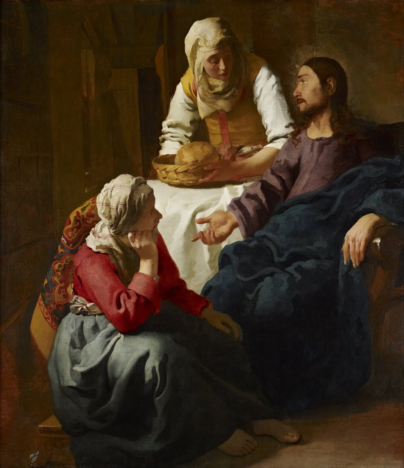 Vermeer's painting of Christ in the house of Martha and Mary: Martha setting a basket of bread on the table while Mary sits listening.